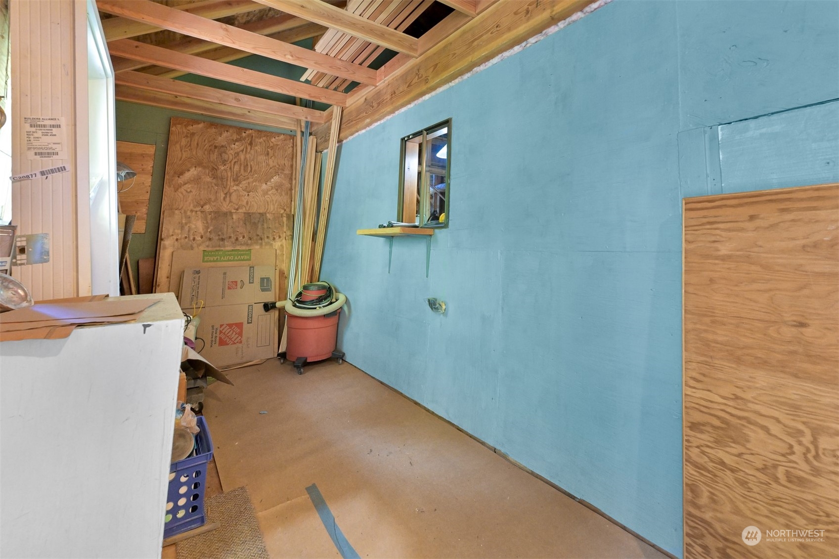 2125 Butler Creek Road Sedro-Woolley, WA 98284 - Photo 27 of 40 a view of a hallway with a door and wooden floor