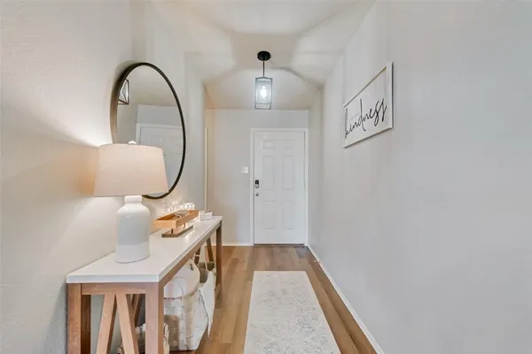 a view of entryway with wooden floor