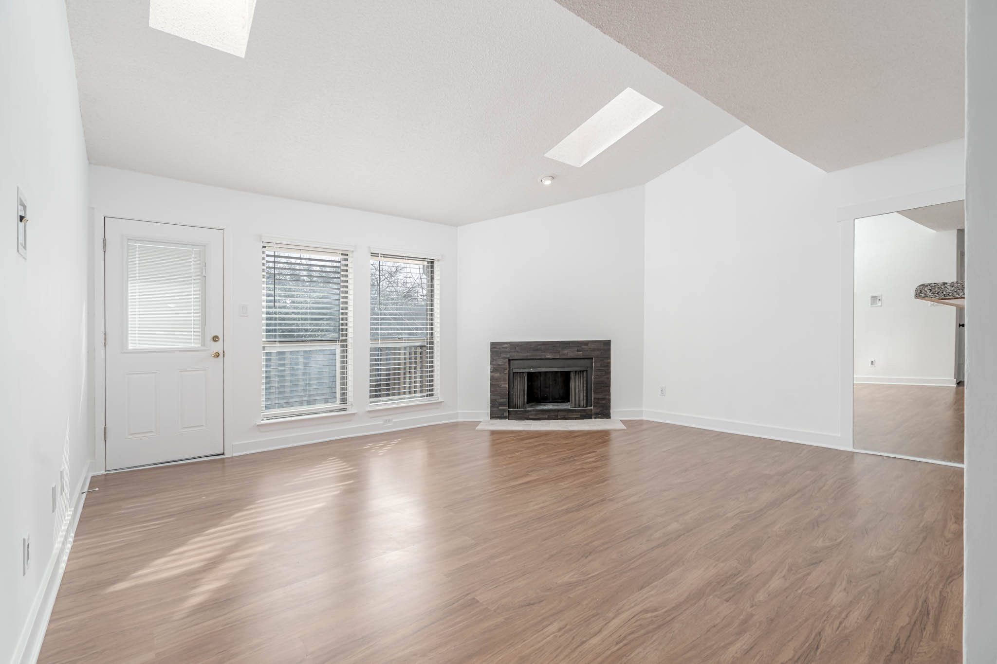 2277 South Kirkwood Road, Unit 4/808 Houston, TX 77077 - Photo 5 of 23 Airy elegance of this space with its high ceilings and abundant natural light, creating a welcoming and open atmosphere.