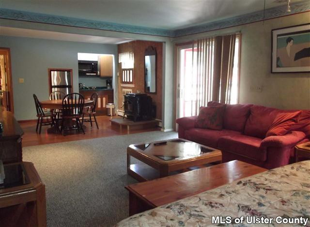 9 George Sickle Road Saugerties, NY 12477 - Photo 17 of 17 a living room with furniture and a large window