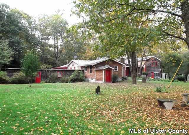 9 George Sickle Road Saugerties, NY 12477 - Photo 2 of 17 a front view of a house with garden