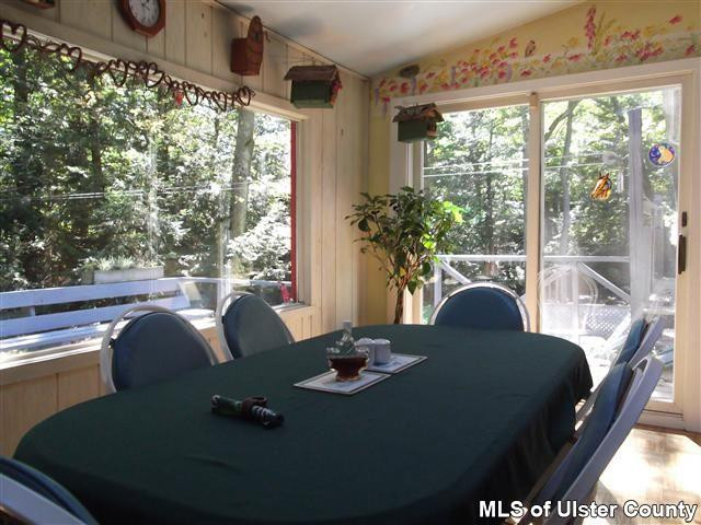 9 George Sickle Road Saugerties, NY 12477 - Photo 4 of 17 a view of a dining room with furniture window and outside view