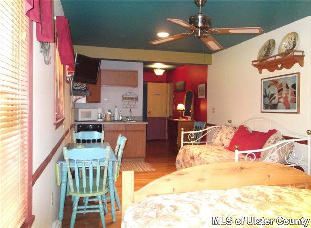 9 George Sickle Road Saugerties, NY 12477 - Photo 7 of 17 a living room with furniture a chandelier and a dining table