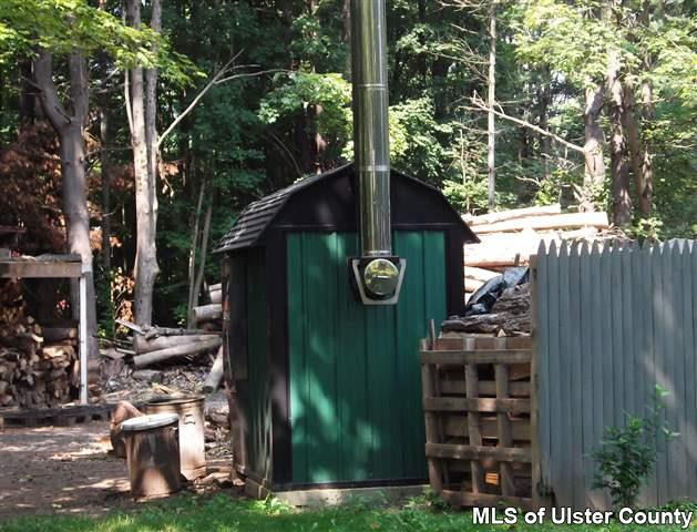 9 George Sickle Road Saugerties, NY 12477 - Photo 9 of 17 a view of a wooden door and a tree in the background