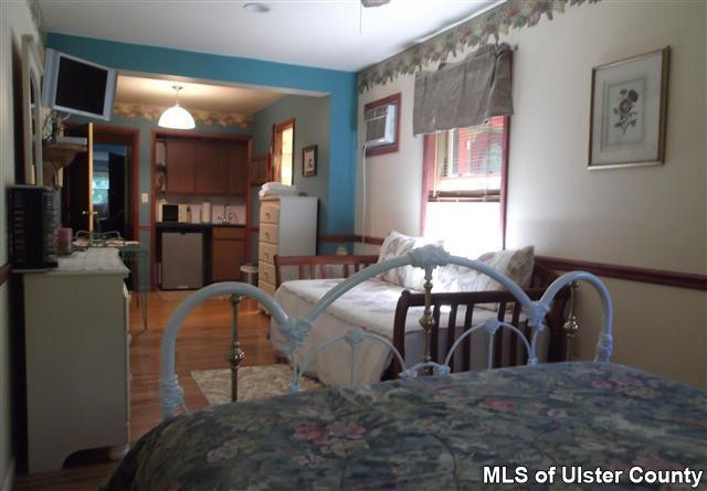 9 George Sickle Road Saugerties, NY 12477 - Photo 10 of 17 a view of a dining room with furniture and chandelier