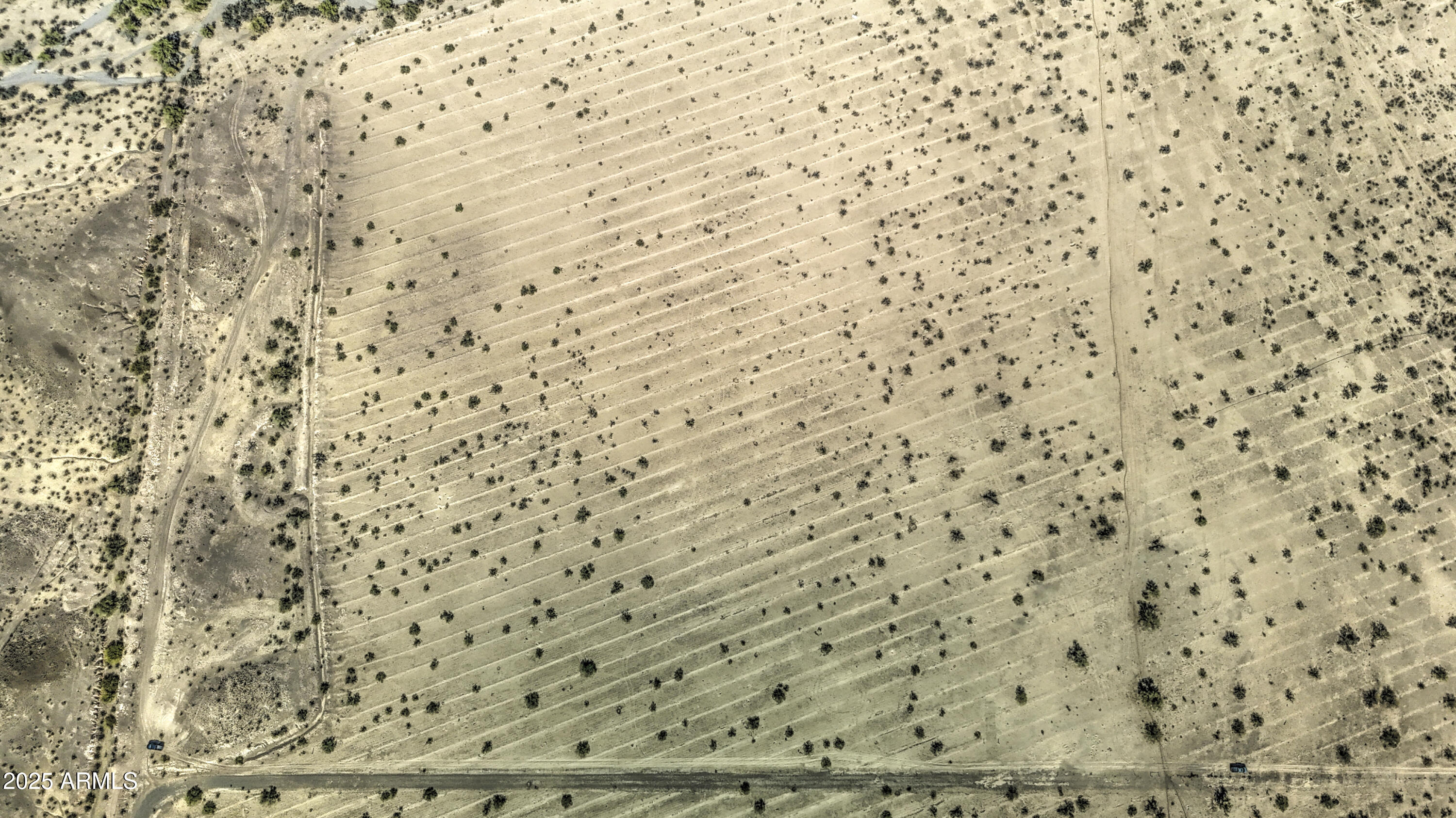 0 West Elliot Road, Unit 40150011A Tonopah, AZ 85354 - Photo 50 of 53 a bathroom with a shower curtain