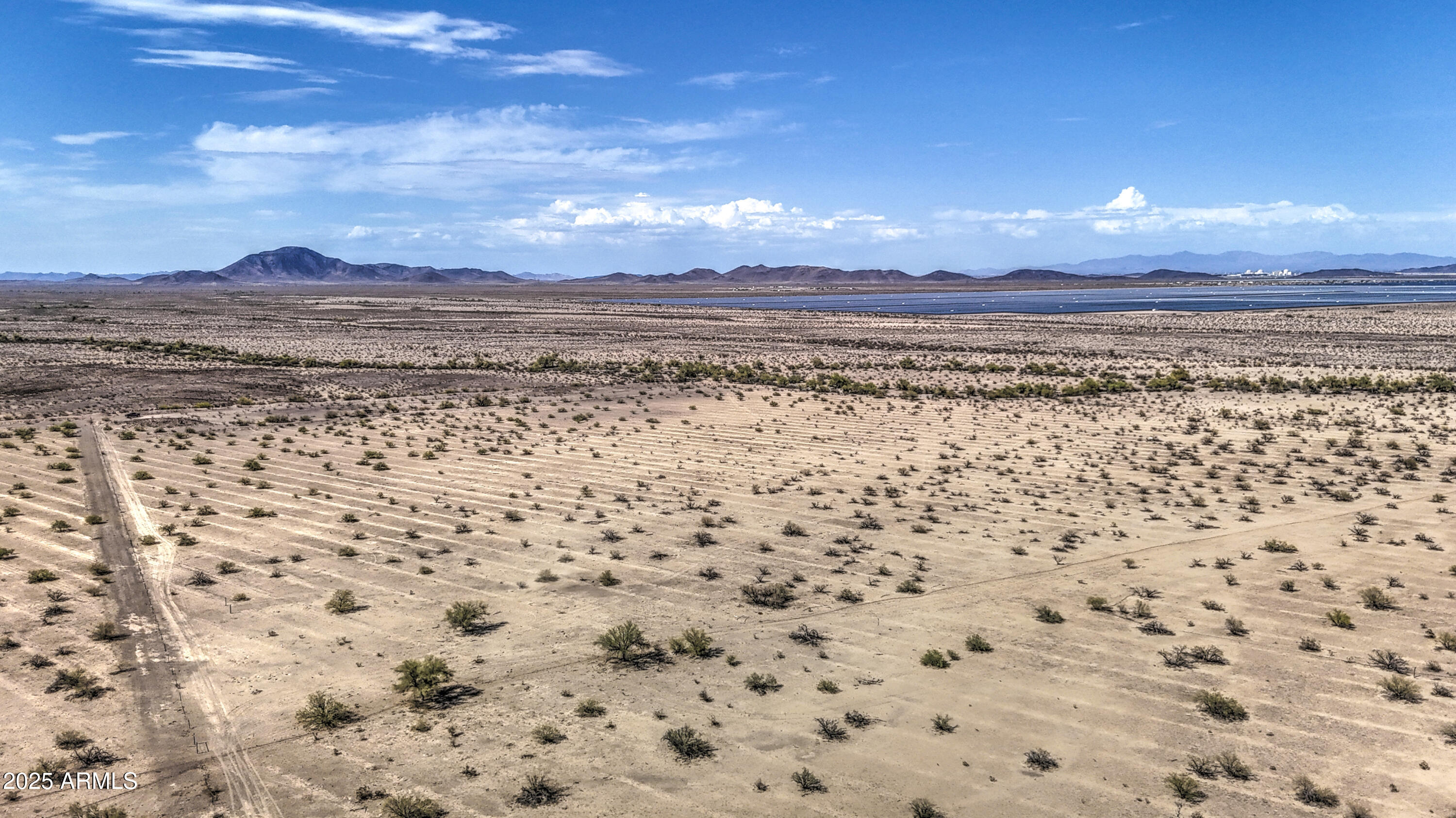 0 West Elliot Road, Unit 40150011A Tonopah, AZ 85354 - Photo 5 of 53 a view of a pathway with an ocean in the background