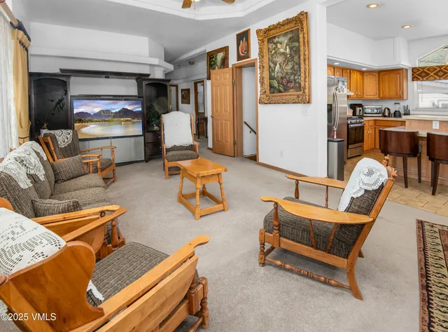 a living room with furniture and flat screen tv