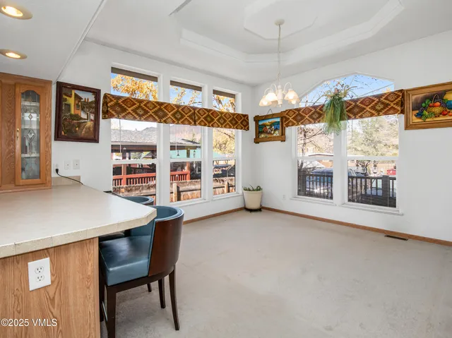 a view of a room with furniture and window