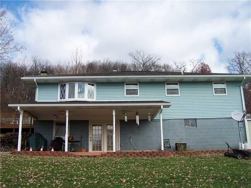 554 Hill Road Georgetown, PA 15043 - Photo 14 of 17 Exterior Back. Walk out basement to covered back deck, home also has wolmanized side deck