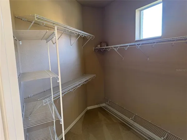 a view of a room with racks on the wall