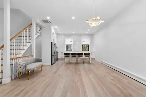 an entryway and livingroom with furniture