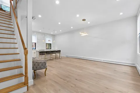 a view of entryway and kitchen