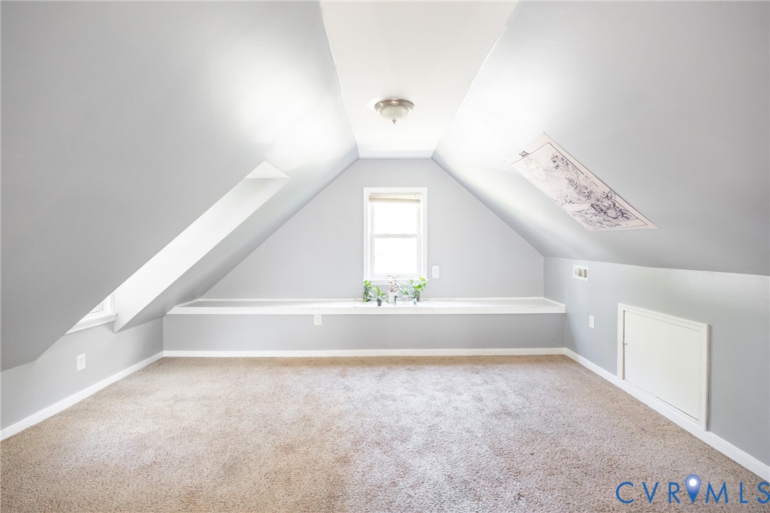 3505 Meadowbridge Road Richmond, VA 23222 - Photo 16 of 20 Carpeted room featuring sloped ceilings, a centere