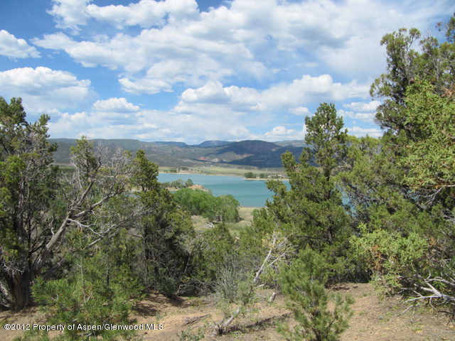 Lot 3 County Road 237 Rifle, CO 81650 - Photo 1 of 5 a view of a lake with houses in back