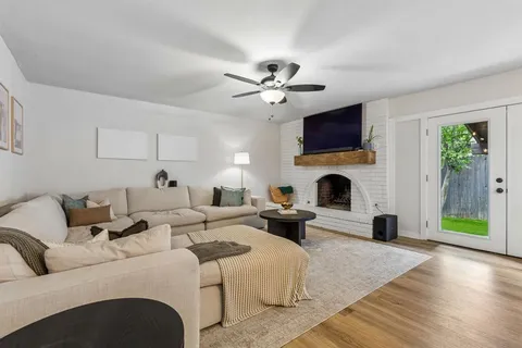 a living room with furniture and a lamp