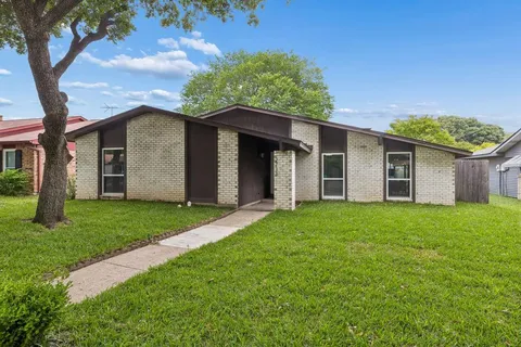 front view of a house with a yard