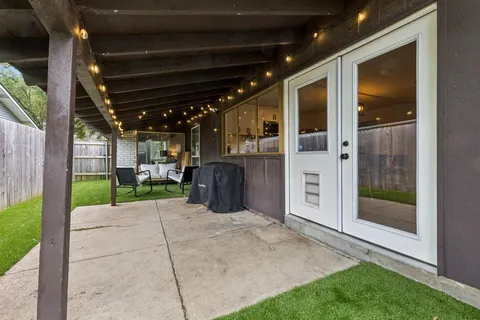 a house view with a sitting space and garden
