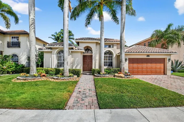 front view of a house with a garden