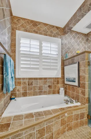 a living room with furniture and a work place area