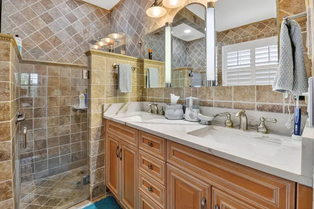 a view of a patio with table and chairs and potted plants