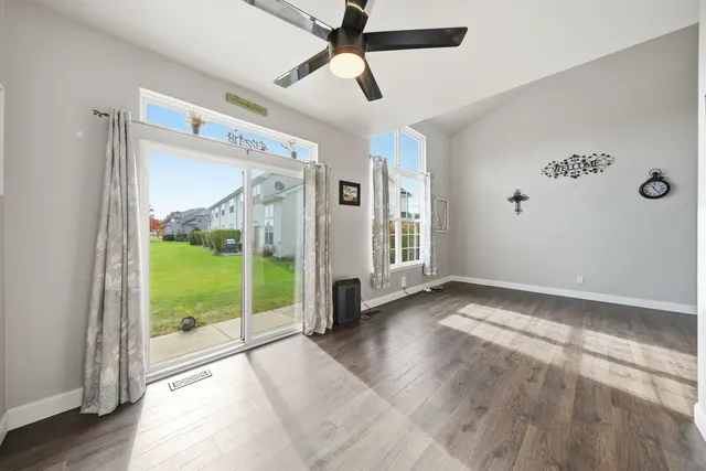 a view of an empty room and glass door