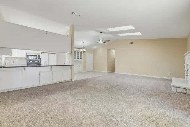 a view of a kitchen with a sink