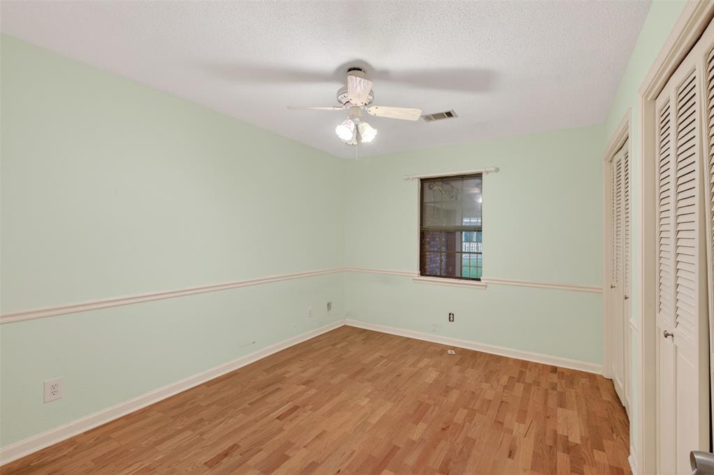 401 Cane Bend Drive Haughton, LA 71037 - Photo 14 of 27 wooden floor in an empty room with a window
