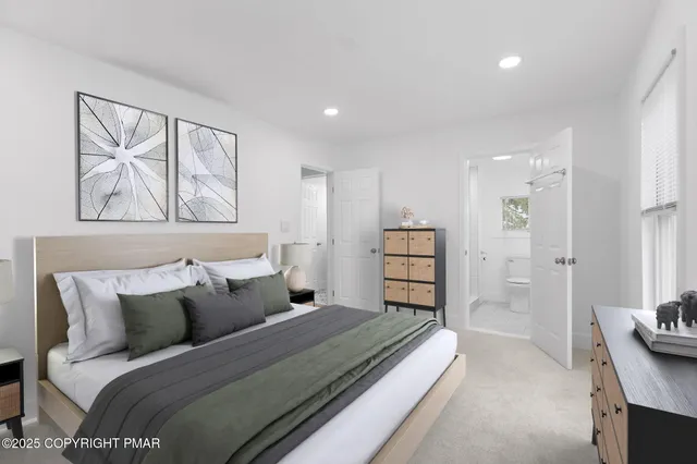 a bedroom with a bed and a couch