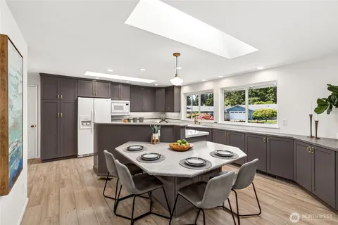 a kitchen with a table and chairs in it