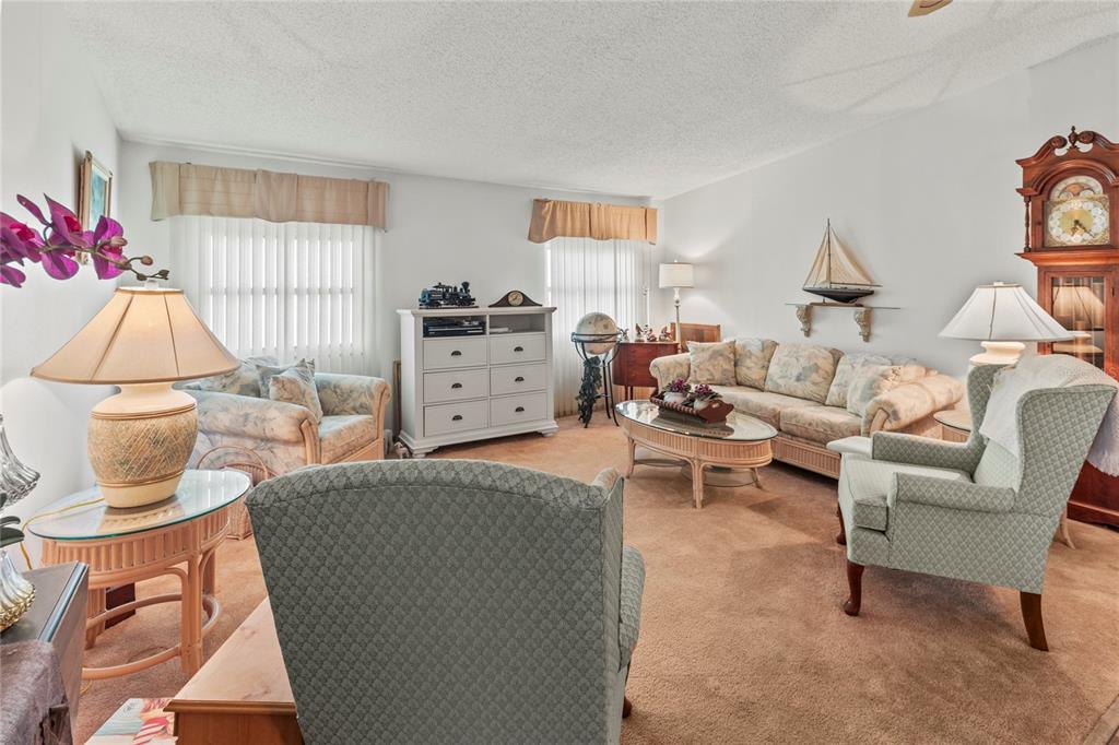 83 Eagle Circle Ellenton, FL 34222 - Photo 6 of 60 a living room with furniture a window and a table