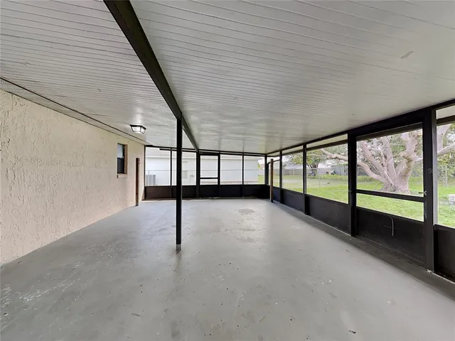 a view of an empty room with a large window