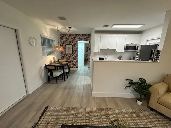 a living room with furniture and a rug