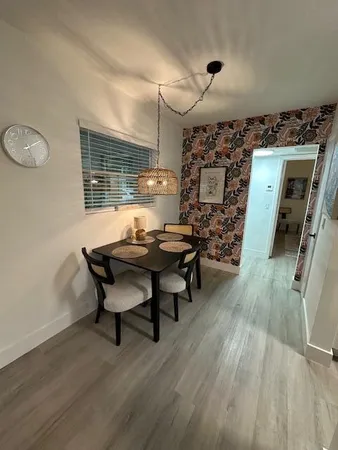 a workspace room with furniture and wooden floor