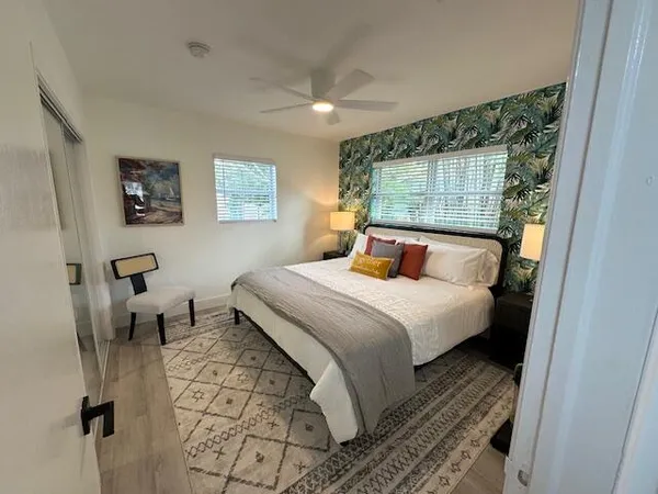 a bedroom with a bed and window