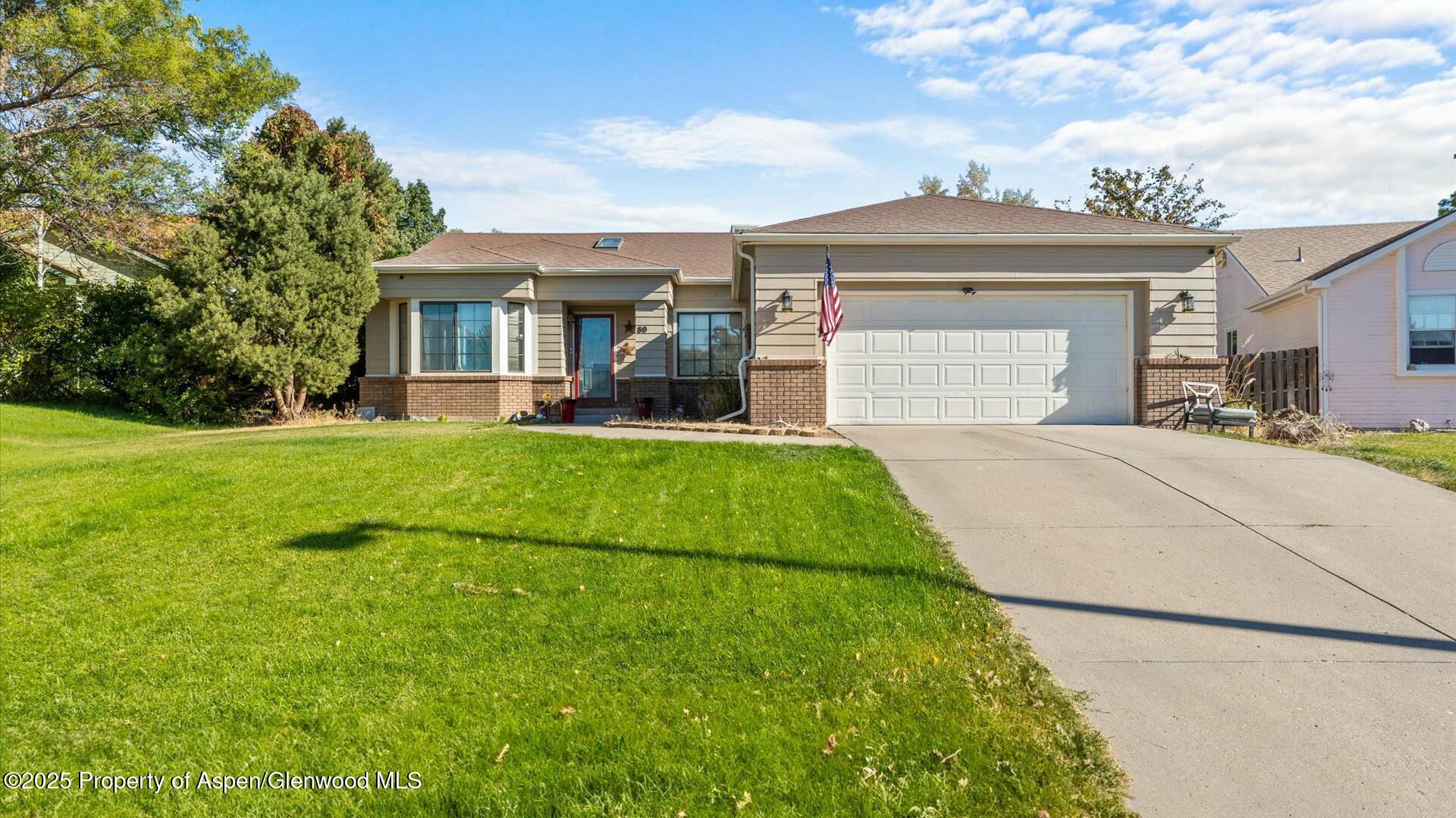 80 Juniper Lane Parachute, CO 81635 - Photo 2 of 30 a view of a house with a yard and sitting area