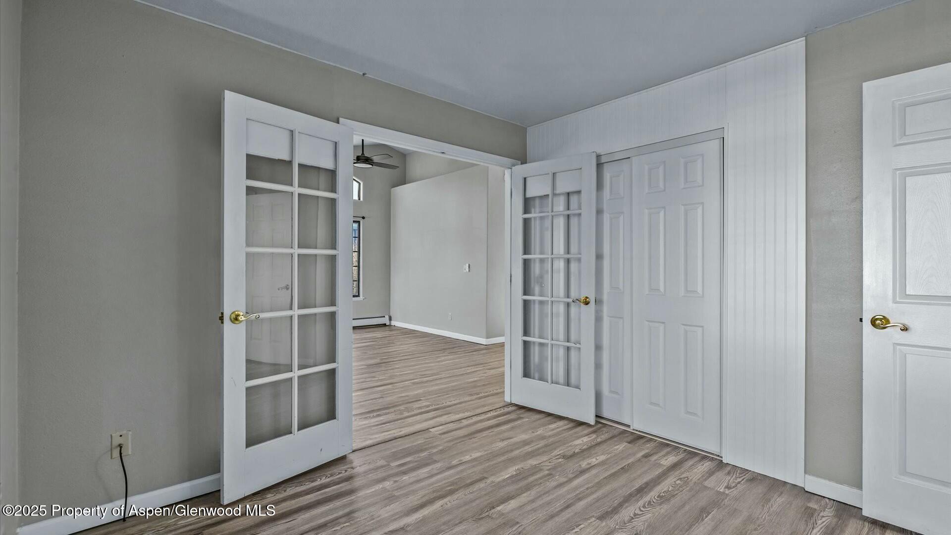 80 Juniper Lane Parachute, CO 81635 - Photo 23 of 30 a view of empty room with wooden floor