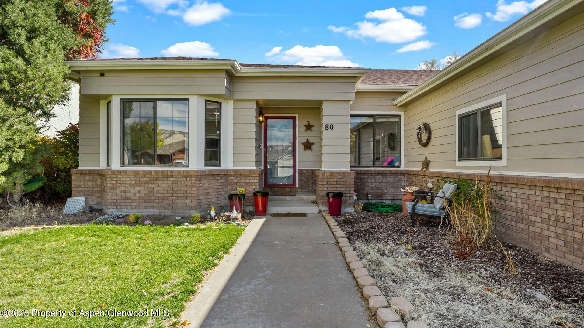 80 Juniper Lane Parachute, CO 81635 - Photo 3 of 30 a front view of a house with a yard