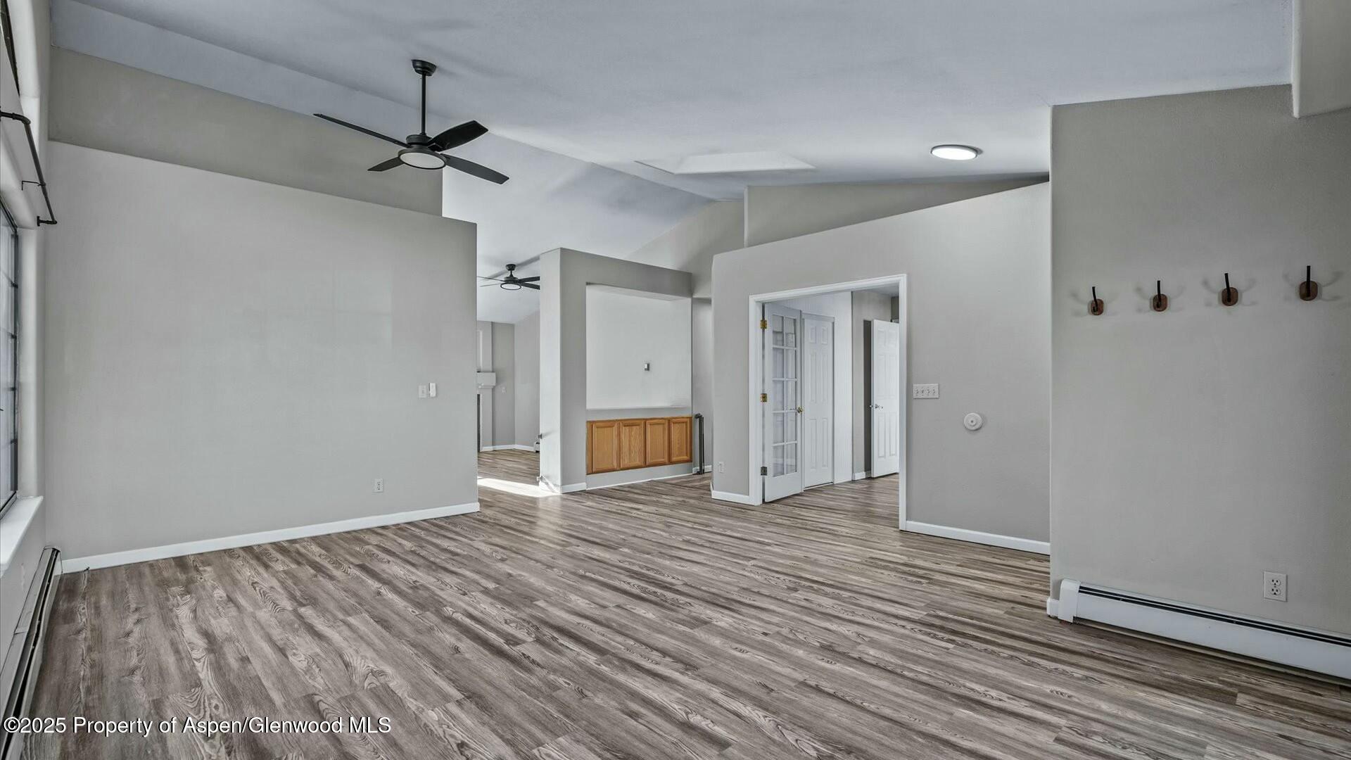 80 Juniper Lane Parachute, CO 81635 - Photo 8 of 30 a view of an empty room with wooden floor