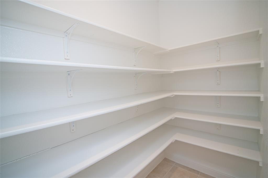 1021 Gillespie Drive Fort Worth, TX 76247 - Photo 11 of 38 a view of an empty walk in closet