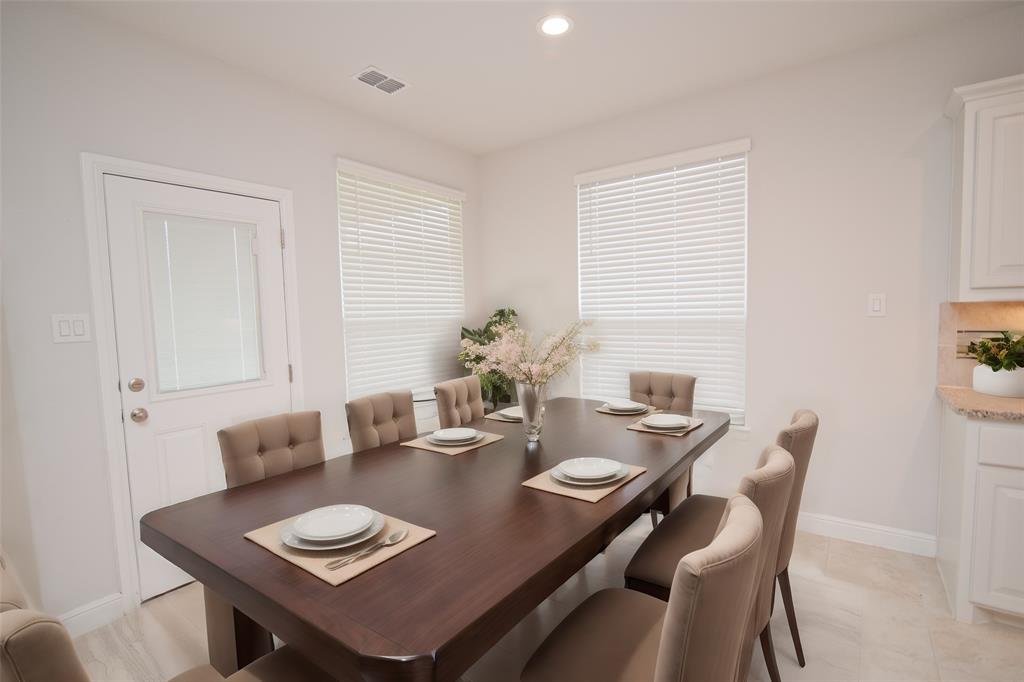 1021 Gillespie Drive Fort Worth, TX 76247 - Photo 12 of 38 a view of a dining room with furniture