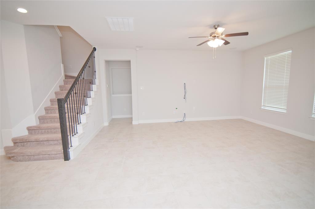 1021 Gillespie Drive Fort Worth, TX 76247 - Photo 13 of 38 a view of an empty room with stairs
