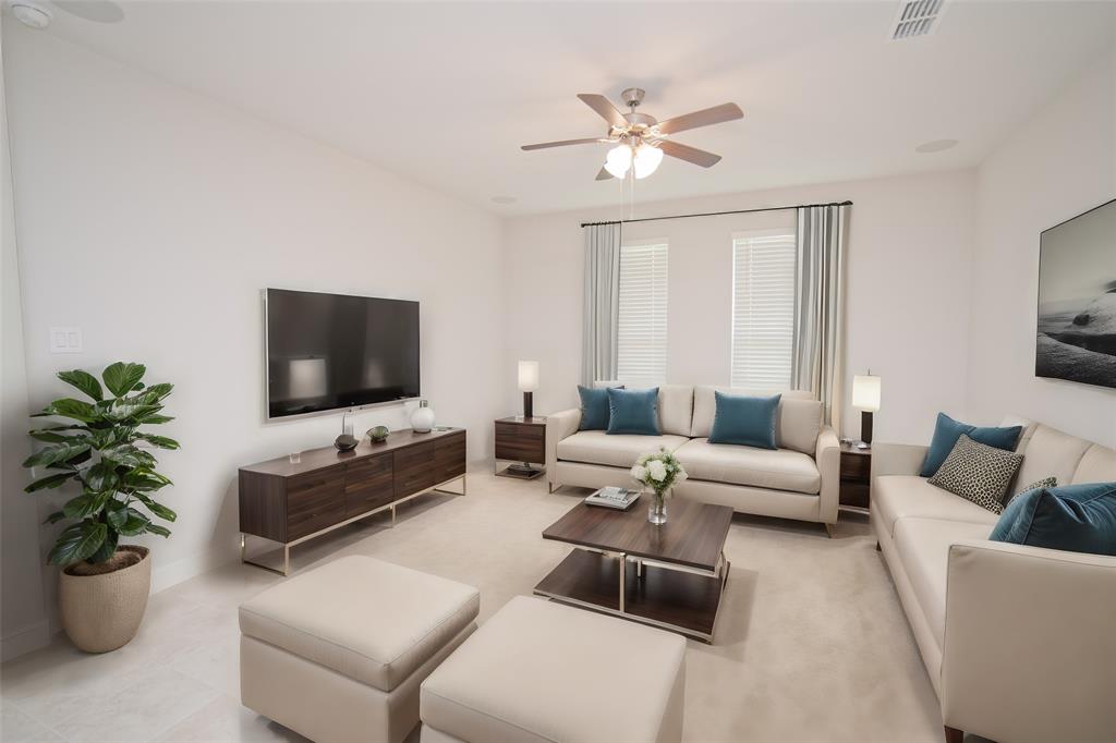 1021 Gillespie Drive Fort Worth, TX 76247 - Photo 14 of 38 a living room with furniture and a flat screen tv