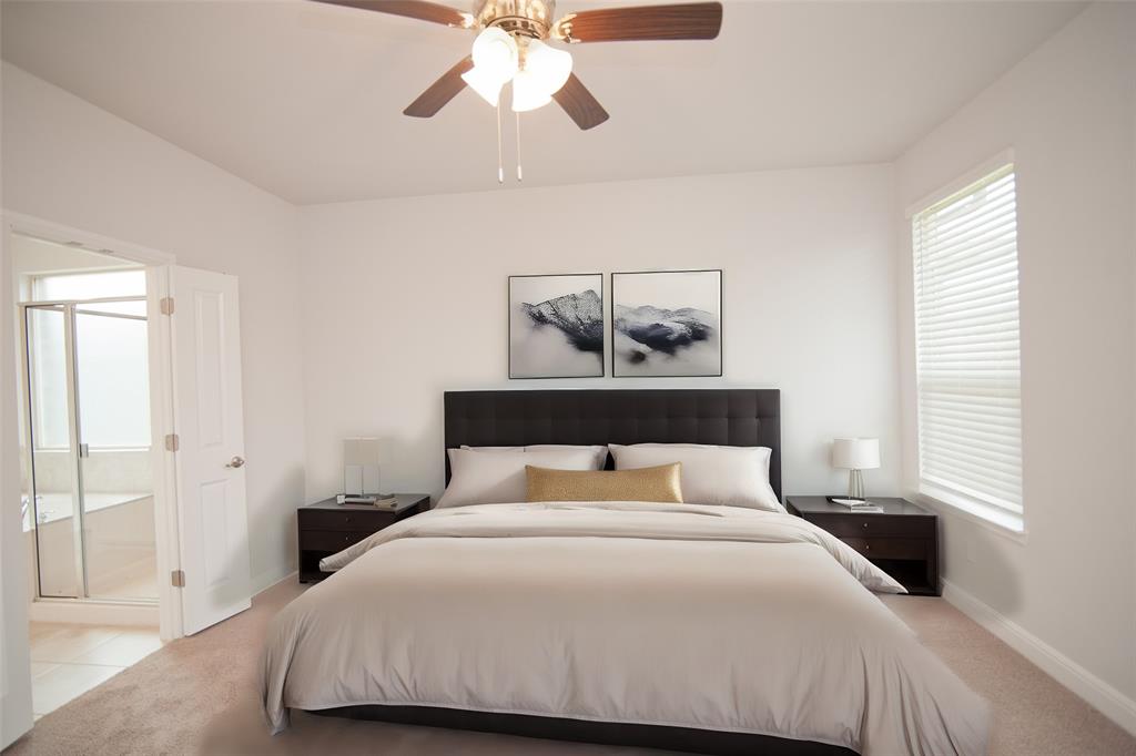 1021 Gillespie Drive Fort Worth, TX 76247 - Photo 16 of 38 a bedroom with a large bed and a chandelier