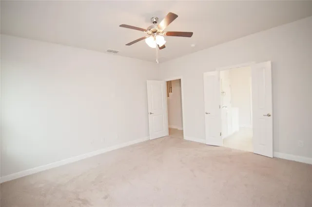a bathroom with a tub sink shower and mirror