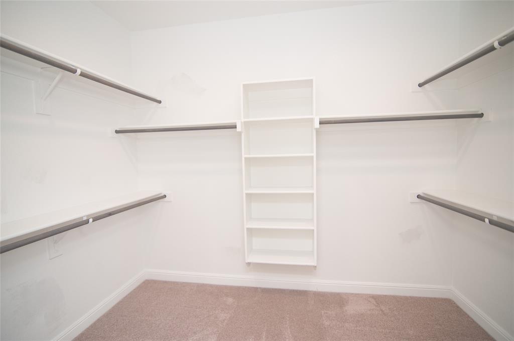 1021 Gillespie Drive Fort Worth, TX 76247 - Photo 21 of 38 a view of an empty walk in closet
