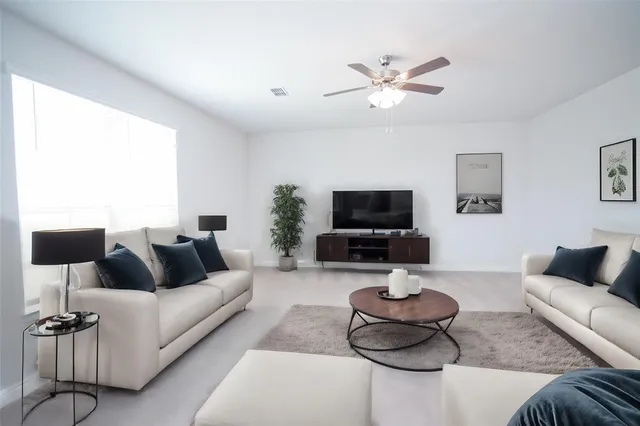 a bathroom with a bathtub shower sink vanity and toilet