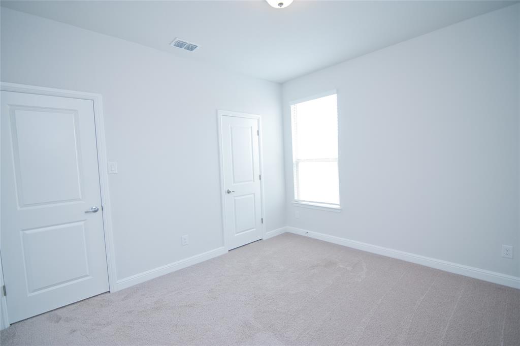 1021 Gillespie Drive Fort Worth, TX 76247 - Photo 27 of 38 an empty room with a window