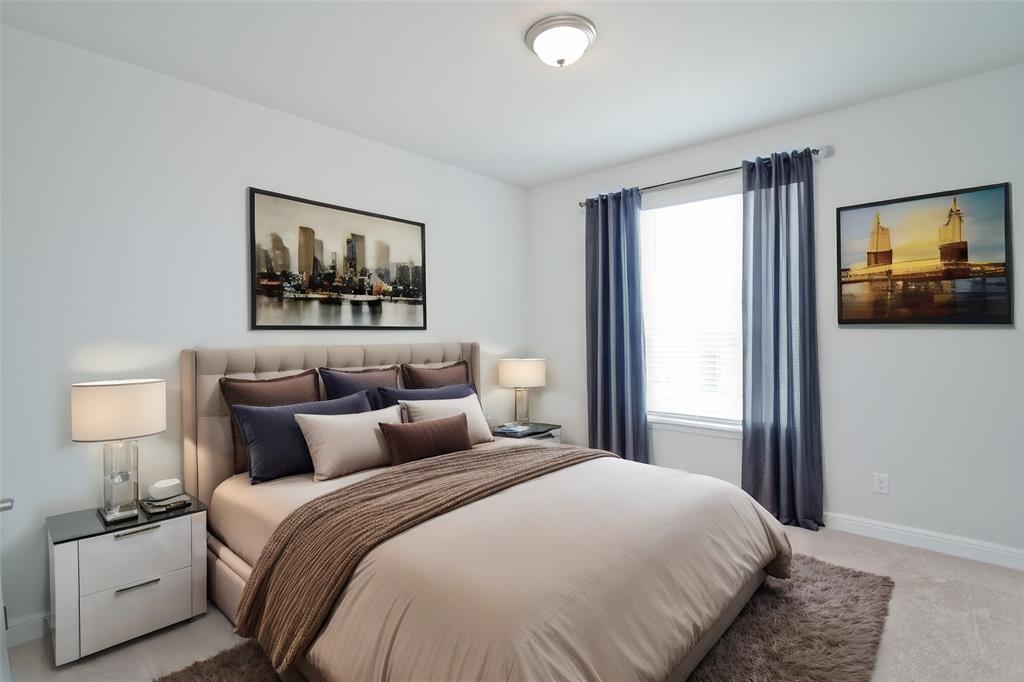 1021 Gillespie Drive Fort Worth, TX 76247 - Photo 31 of 38 a bedroom with a bed and a painting on the wall