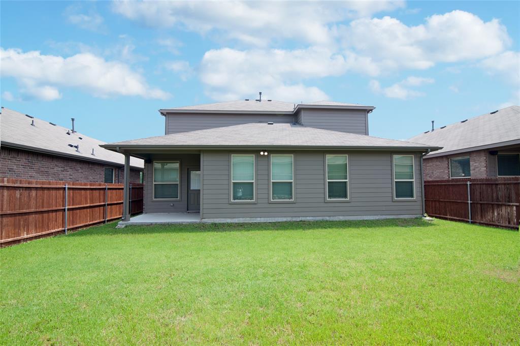 1021 Gillespie Drive Fort Worth, TX 76247 - Photo 34 of 38 a view of a house with a yard and a large tree